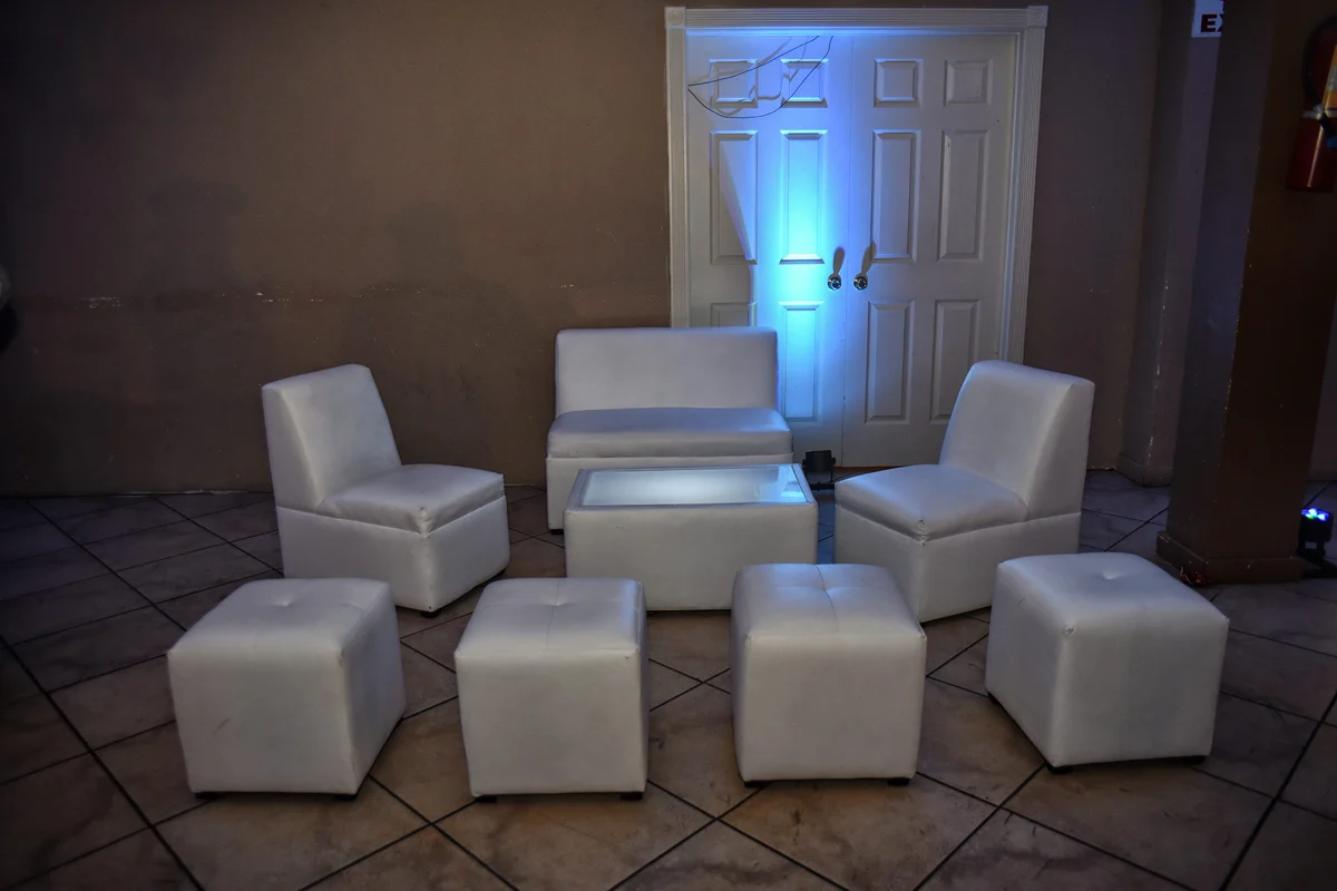 Private seating area with white lounge furniture